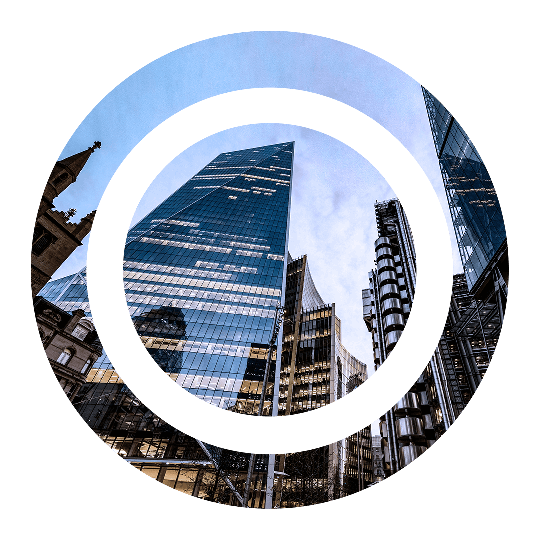Two circles containing photo of business buildings